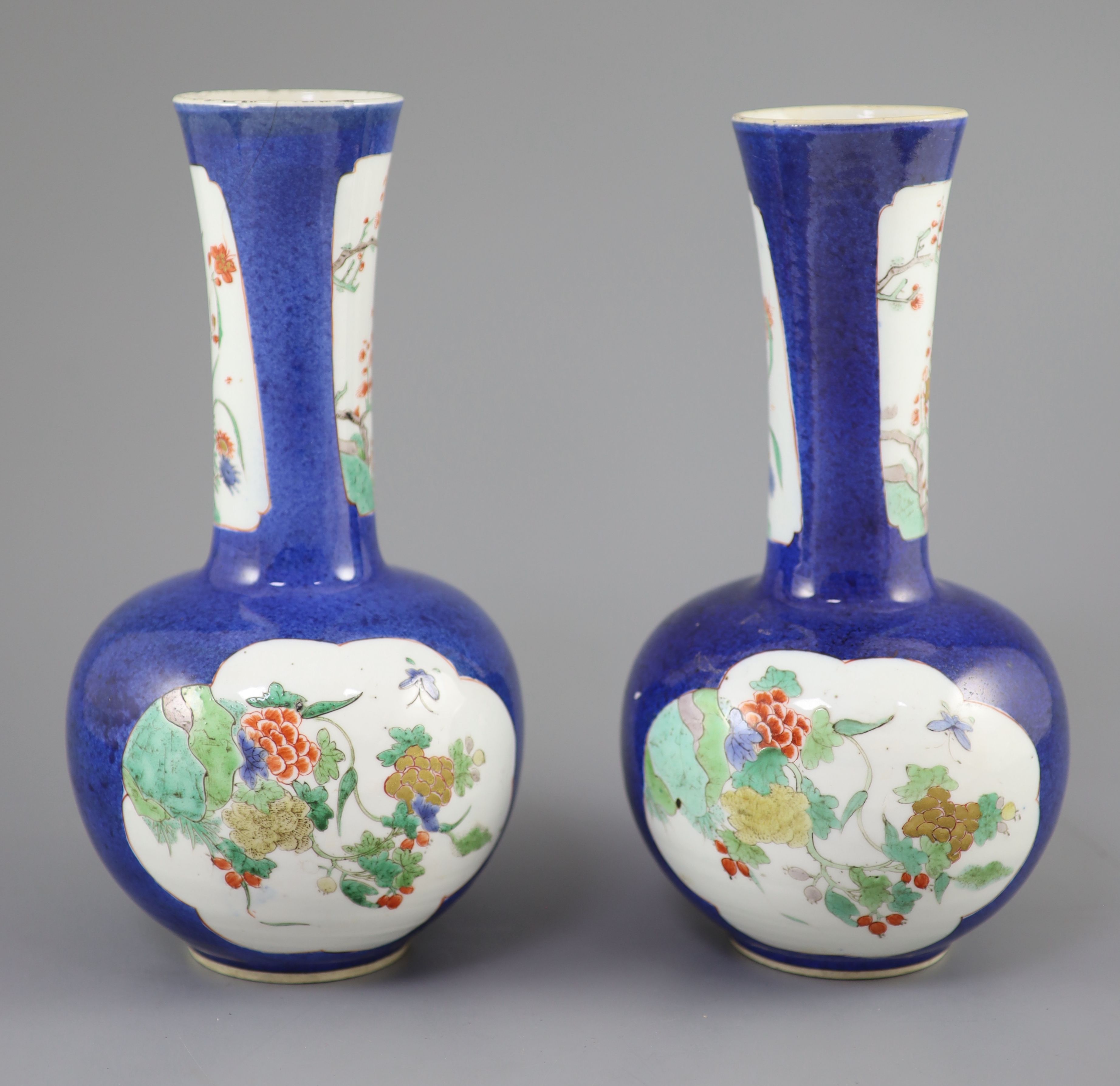 A pair of Chinese powder blue famille verte bottle vases, Kangxi period (1662-1722), 26cm high